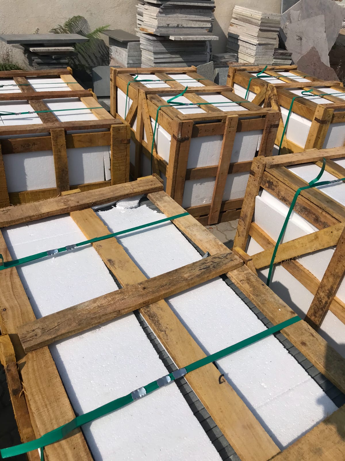 Foam-lined timber crates strapped and numbered for container export