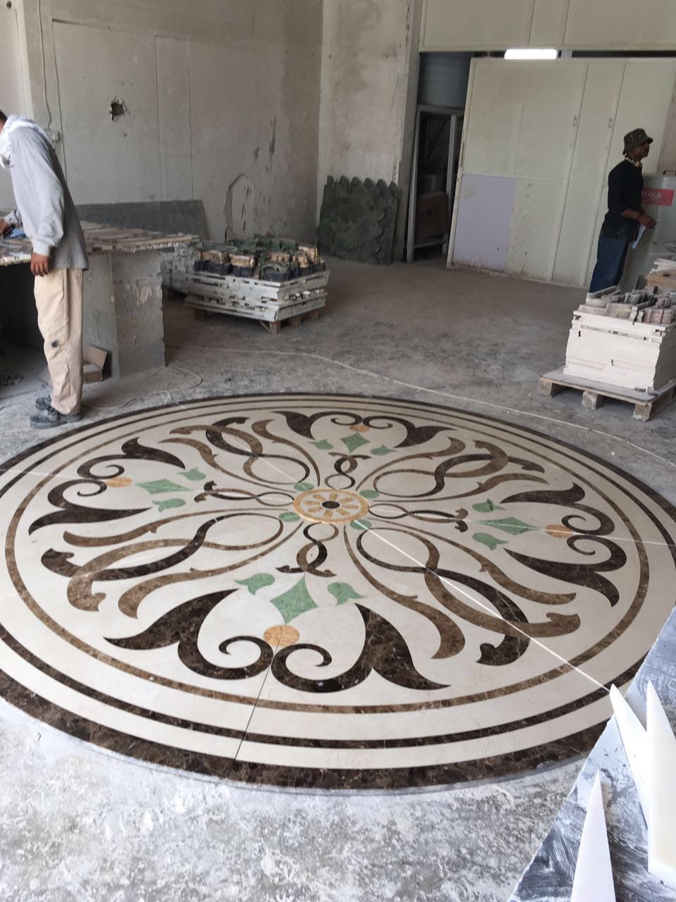 Detail of a polished waterjet marble medallion floor in a residence