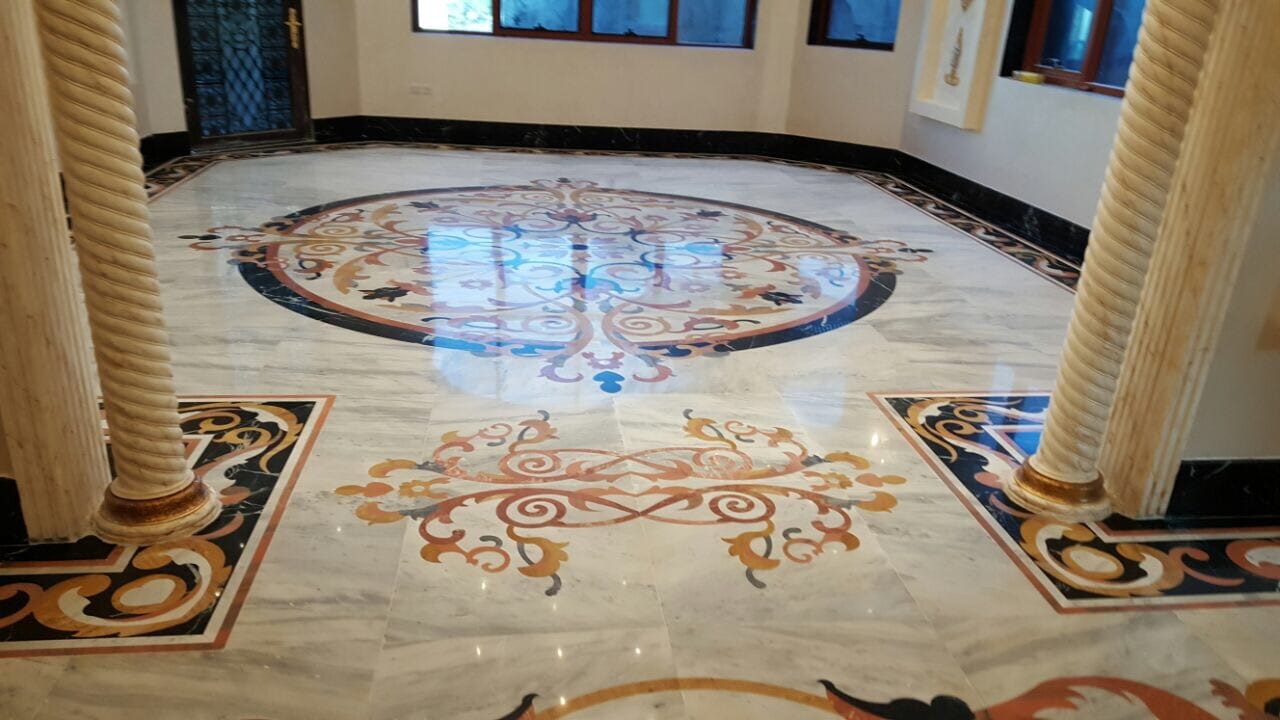 Luxury villa entrance floor with a waterjet marble medallion and colonnade